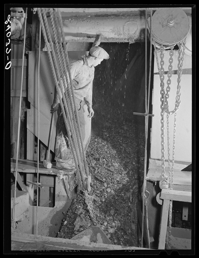 Rocks coming out of gold dredge after ore has been removed. Nye County, Nevada
