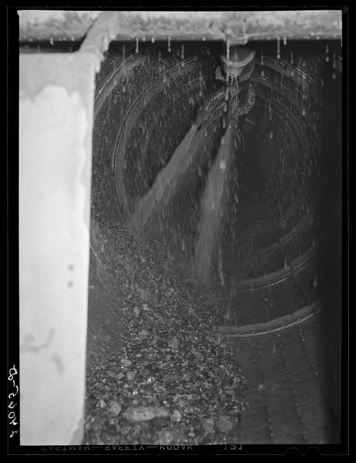 Rocks coming out of gold dredge after ore has been removed. Nye County, Nevada