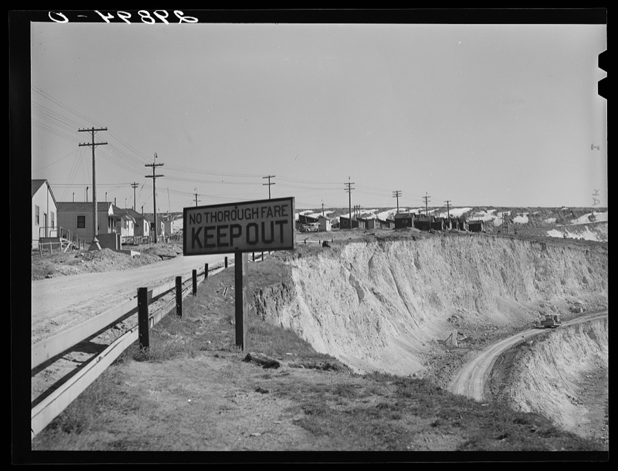Workers' homes on edge of copper pit. Ruth, Nevada