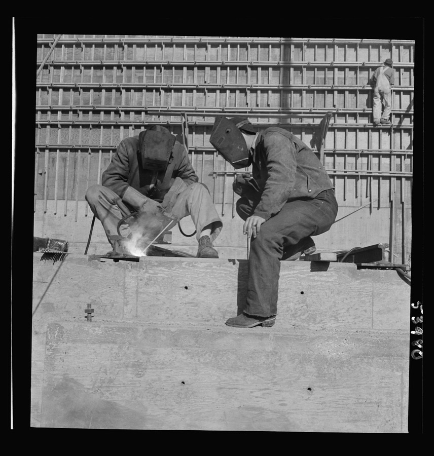 Las Vegas, Nevada. Helmeted welders busy in their part in the completion of the Basic Magnesium plant in the southern Nevada desert, which will turn out great quantities of this lightest of all metals for aircraft and tracer bullet manufacturers