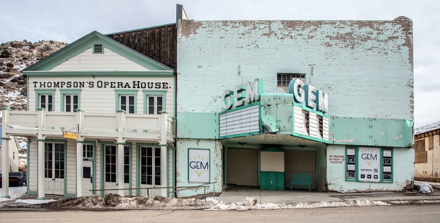Scene of the Thompson's Opera House alongside the Gem Theater in the old mining town of Pioche, which appears to hang along the side of a mountain and in a bowl below in Nevada's high desert, near the state's eastern border with Utah