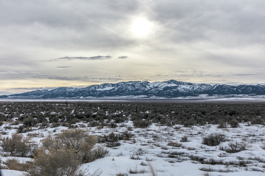 The countryside on a winter day near the old mining town of Pioche, which appears to hang along the side of a mountain and in a bowl below in Nevada's high desert, near the state's eastern border with Utah