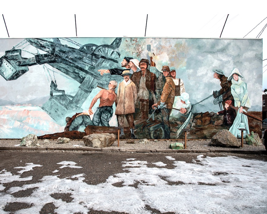 Artist Wei Luan's mural recalling the scene and workers of the historic Liberty Pit Copper Mine in Ely, a remote Nevada mountain town that was once a stagecoach stop and Pony Express station near the Utah border