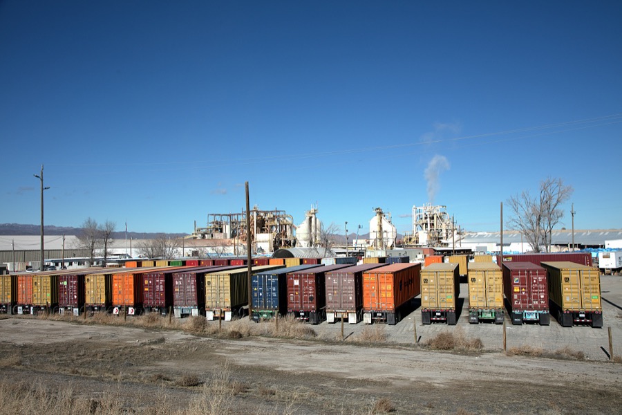 Truck semi-trailers are arrayed outside the U.S. Silica plant in Coal Canyon, Nevada