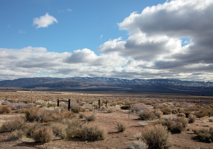Scene in a relatively little-traveled part of the western state of Nevada, in a vast valley ringed by low mountains south of Reno and east of the angled California line, near the small towns of Gardnerville, Wellington, and Yerington