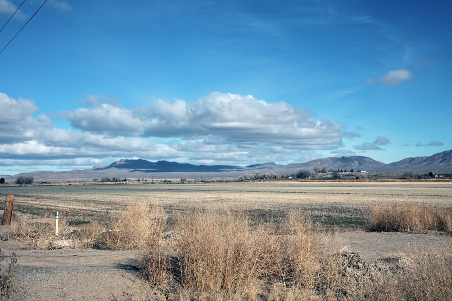 Scene in a relatively little-traveled part of the western state of Nevada, in a vast valley ringed by low mountains south of Reno and east of the angled California line, near the small towns of Gardnerville, Wellington, and Yerington