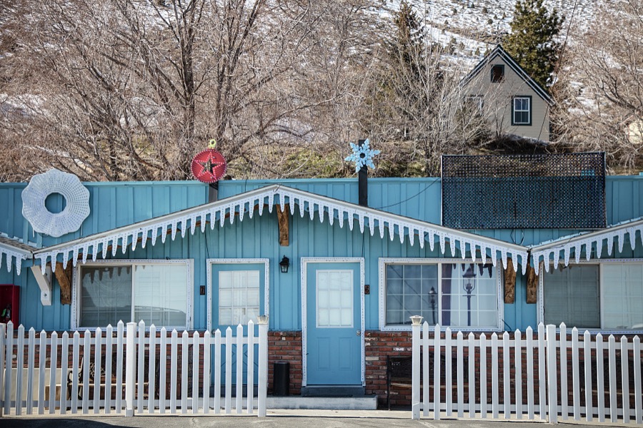 A small, colorfully painted and decorated house in remote Virginia City, Nevada