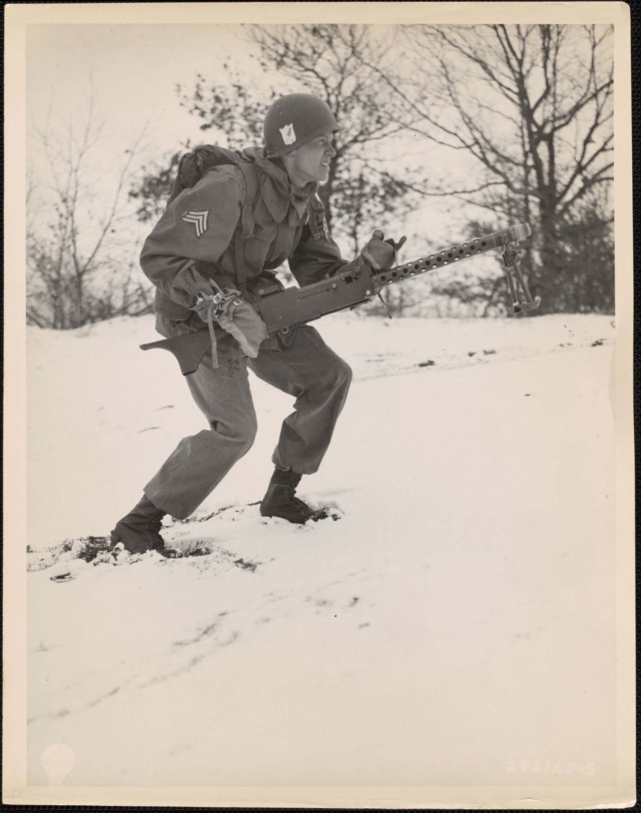 Sgt. Henry Oppenborn advances during a problem in conjunction with "Exercise Snowdrop", American Legion Museum - undated