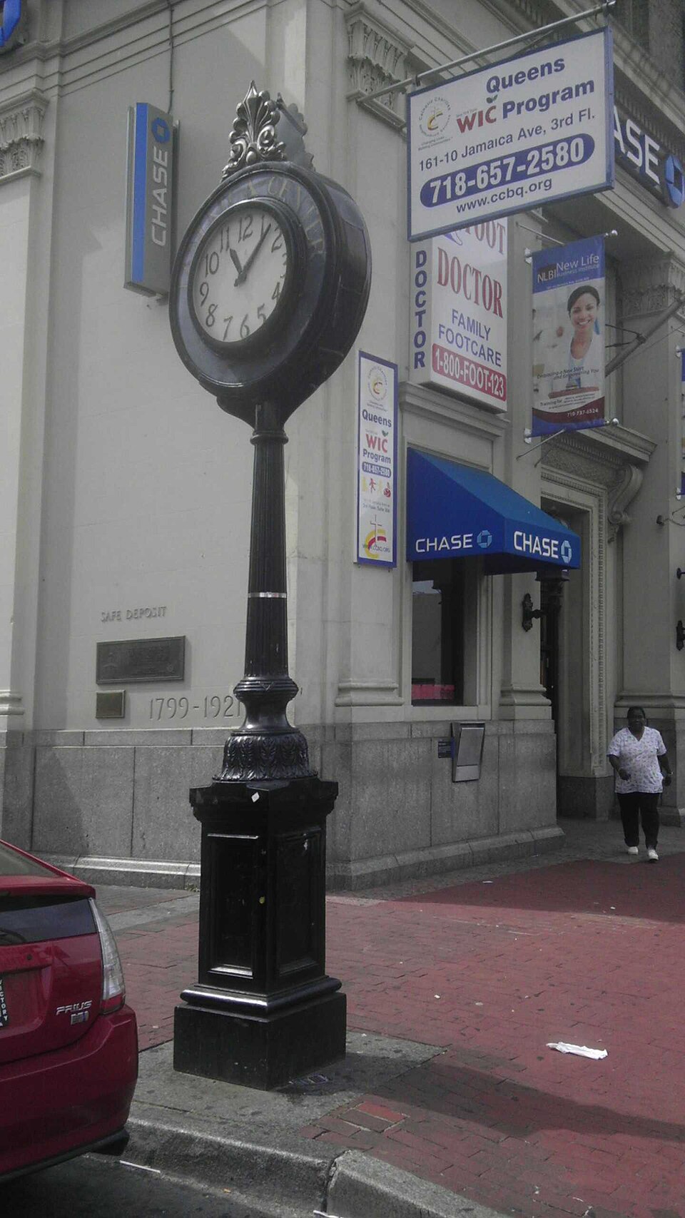 Photograph of Sidewalk clock on Jamaica Avenue