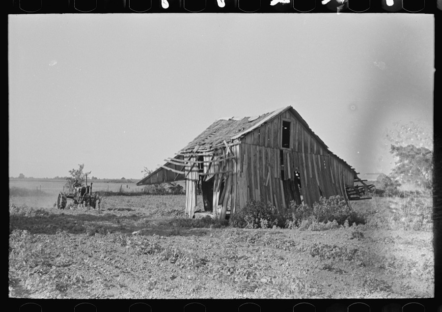 Tractor plowing near abandoned and wrecked tenant house, Wagoner County, Oklahoma