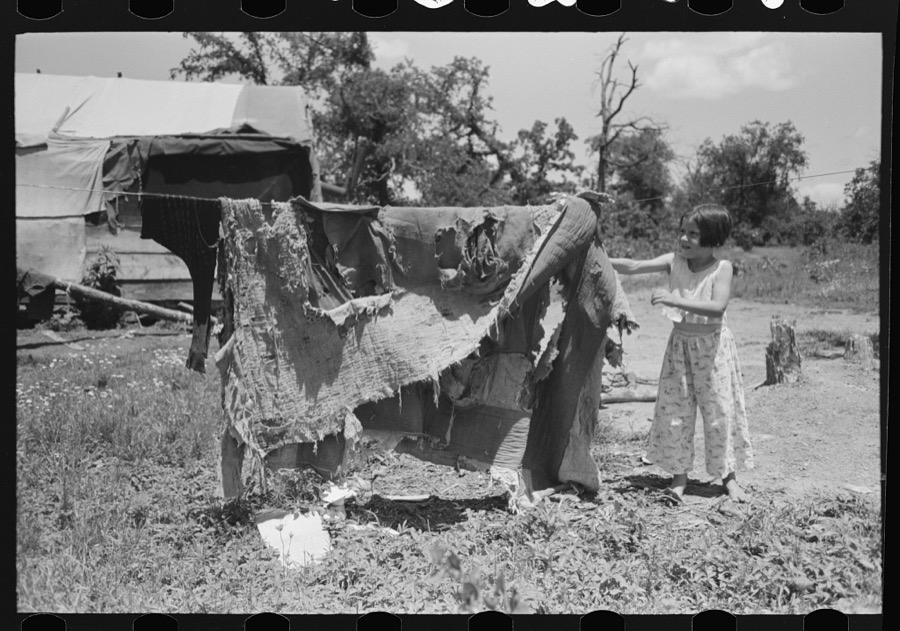 Bedding of agricultural workers' family near Vian, Sequoyah County, Oklahoma