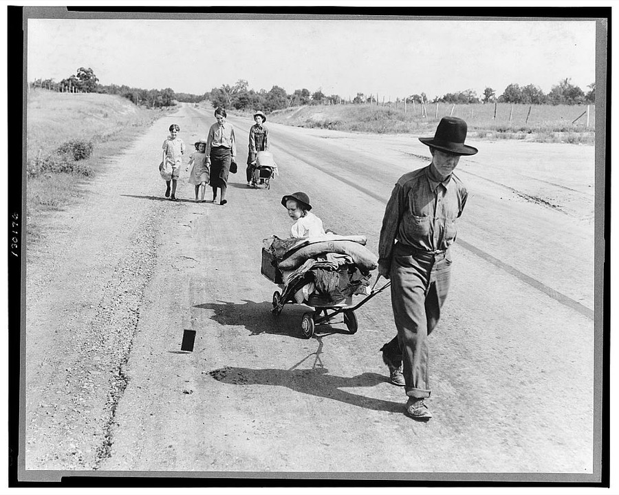 Family walking on highway, five children. Started from Idabel, Oklahoma.  Bound for Krebs, Oklahoma. Pittsburg County, Oklahoma. In 1936 the father farmed on thirds and fourths at Eagleton, McCurtain County, Oklahoma. Was taken sick with pneumonia and lost farm. Unable to get work on Work Prjects [i.e. Projects] Administration and refused county relief in county of fifteen years residence because of temporary residence in another county after his illness