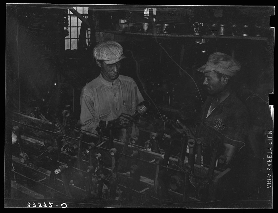 Migrant steeple-jack buying a replacement connecting rod at secondhand automobile parts store. Prague, Oklahoma, Lincoln County