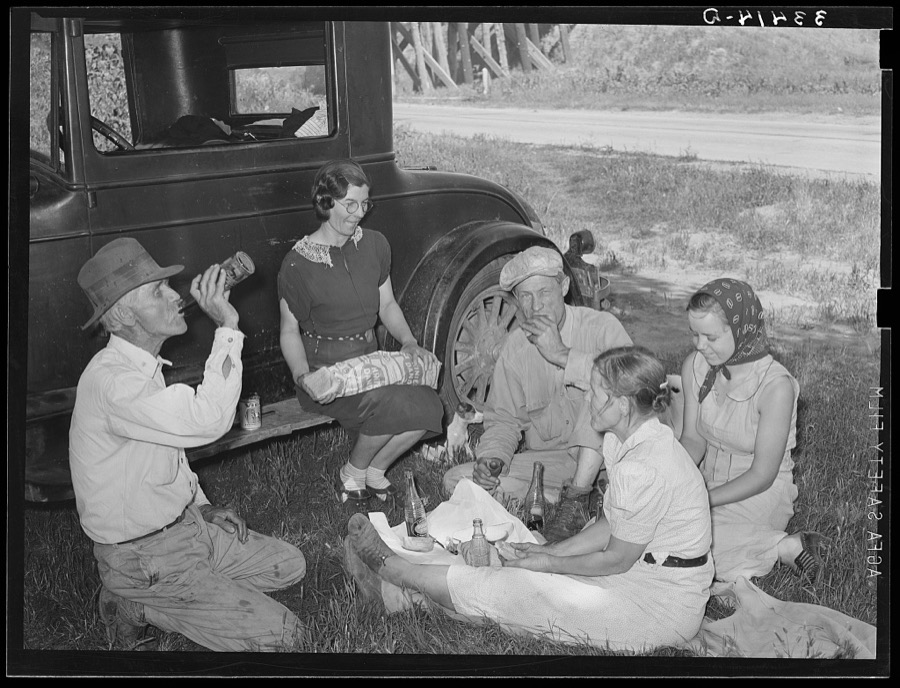 Migrant steeple-jack and his family eating a "bought lunch" by the roadside Near Prague, Oklahoma, Lincoln County