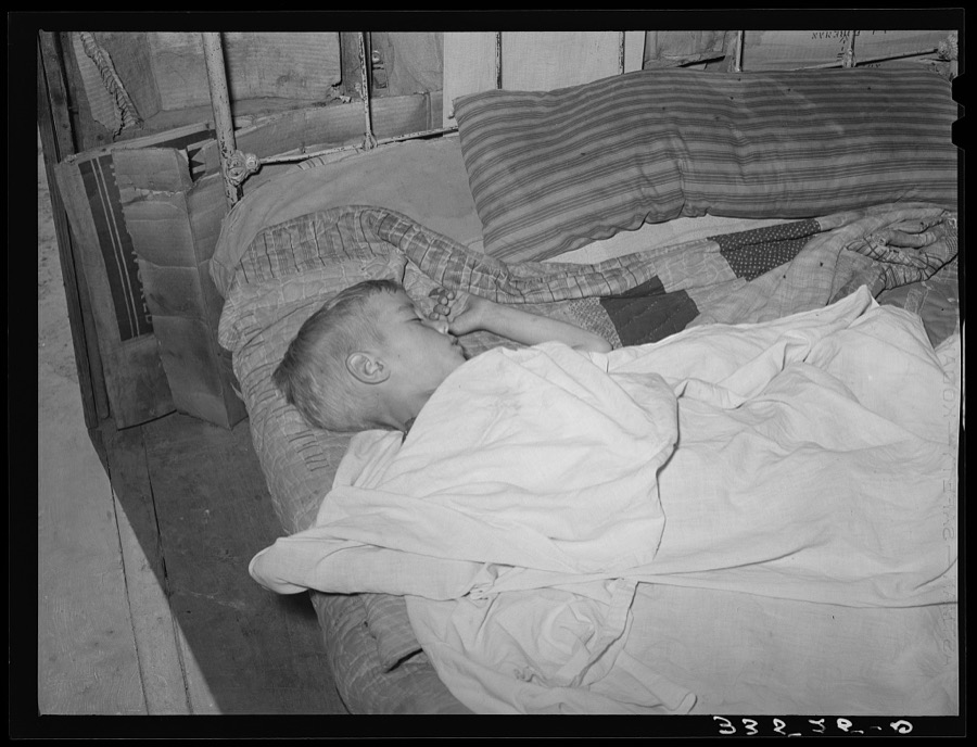 Boy asleep in house in Arkansas River bottom near Vian. Oklahoma, Sequoyah County
