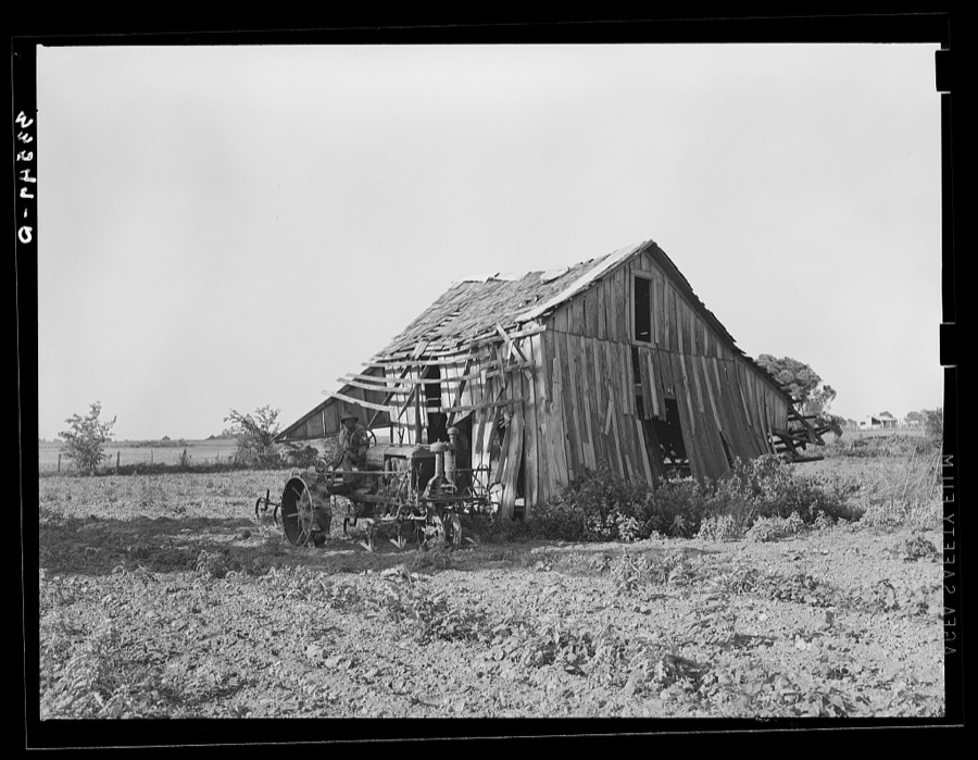 Abandoned tenant farmhouse in field of cotton in Wagoner County, Oklahoma