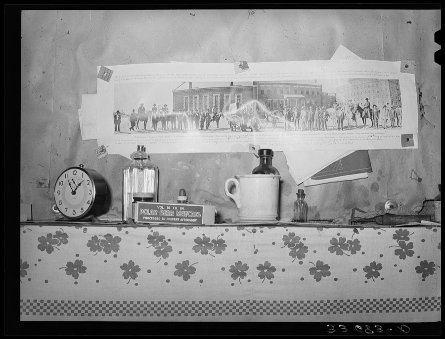 Articles on mantelpiece and photograph showing last reunion of deputy U.S. Marshals in Indian territory. Scene in home of farm family now on WPA (Works Progress Administration/ Work Projects Administration) near Sallisaw, Oklahoma
