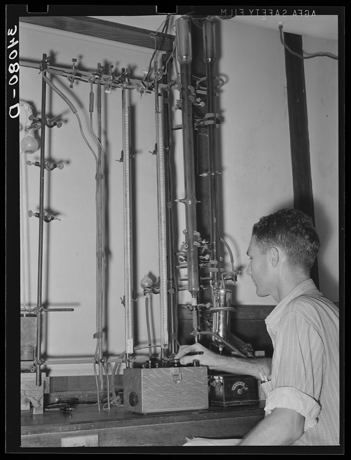 Oil refinery chemist conducting analysis. Seminole, Oklahoma