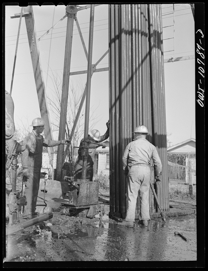 Oklahoma City, Oklahoma. Tubing and rods removed from an oil well for repairing