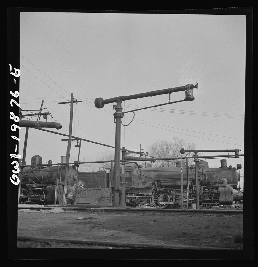 Waynoka, Oklahoma. Oil and water derricks at the roundhouse between Kansas City, Missouri and Clovis, New Mexico. The Atchison, Topeka, and Santa Fe Railroad engines use oil for fuel