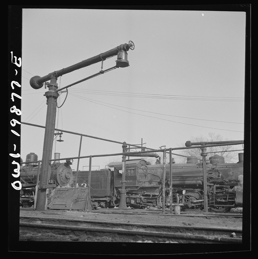Waynoka, Oklahoma. Oil and water derricks at the roundhouse between Kansas City, Missouri and Clovis, New Mexico. The Atchison, Topeka, and Santa Fe Railroad engines use oil for fuel