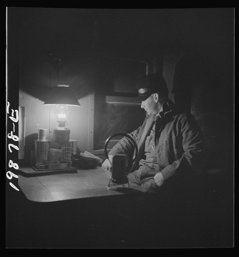 Waynoka, Oklahoma. Brakeman Jack Torbet, sitting at the window of the caboose pulling out of Waynoka, Oklahoma on the Atchison, Topeka, and Santa Fe Railroad