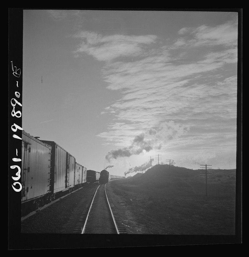 Belva, Oklahoma. Helper engine coming to help push the train on the Atchison, Topeka, and Santa Fe Railroad as far as Curtis, Oklahoma