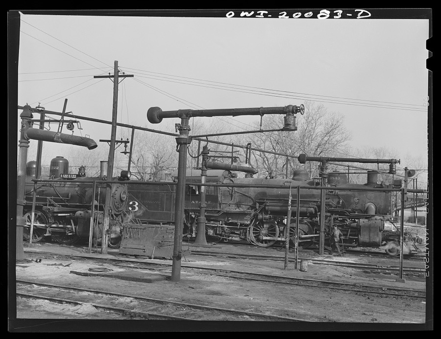 Waynoka, Oklahoma. Oil and water derricks near the Atchison, Topeka and Santa Fe Railroad roundhouse