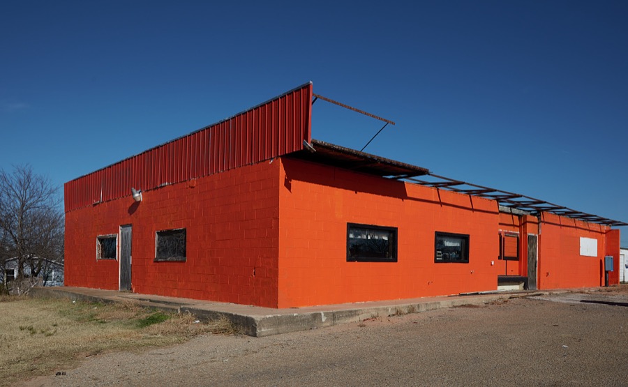 An otherwise-ordinary commercial building in the small Oklahoma city of Yale that's famous locally for being, shockingly orange