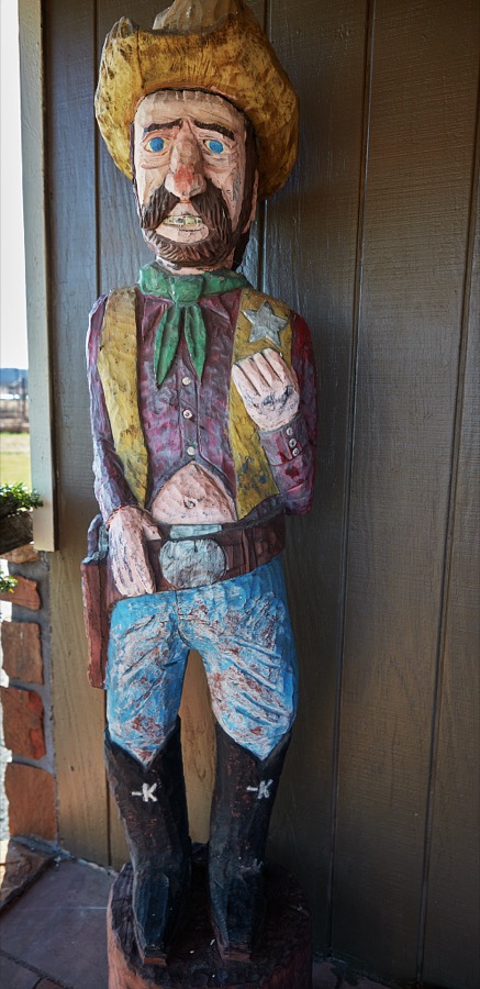 Cowboy wood carving outside the Osage Trading Company, a store built on the model of an old trading post in Pawhuska, a small city in Osage County, Oklahoma
