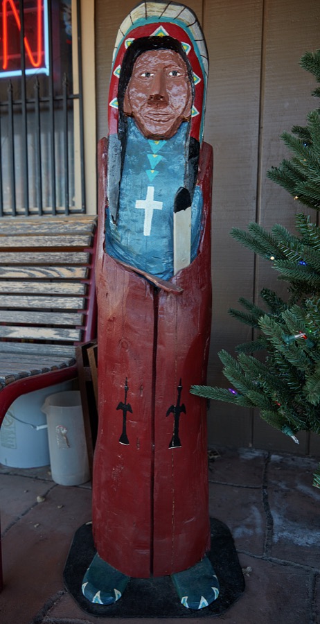 Wood carving of an American Indian outside the Osage Trading Company, a store built on the model of an old trading post in Pawhuska, a small city in Osage County, Oklahoma