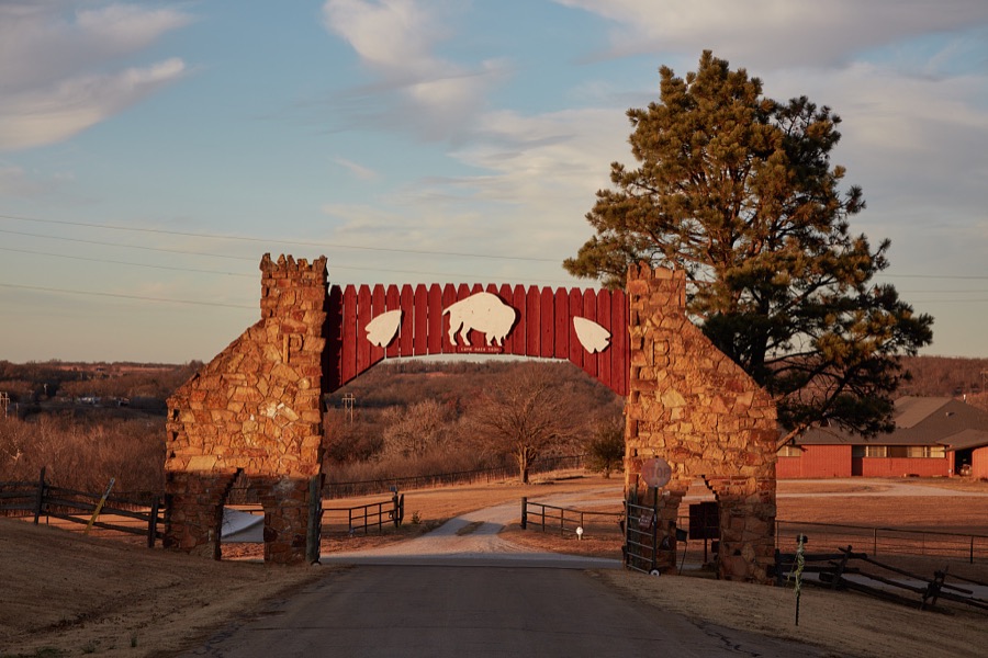 The exit side of the gateway to Pawnee Bill's Ranch in Pawnee, a small city in north-central Oklahoma named for the Pawnee people, was one of the American Indian tribes forcefully removed and marched, mostly on foot, from eastern states to what was called "Indian Territory" on the windy midwest plains in the 1870s