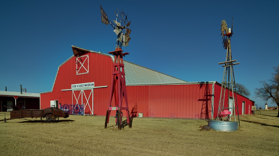 Windmills and a bright-red barn at the National Route 66 Museum in Elk City, Oklahoma, along the historic "Mother Road" that ran (and still does in limited sections) from Chicago, Illinois, to Santa Monica, California