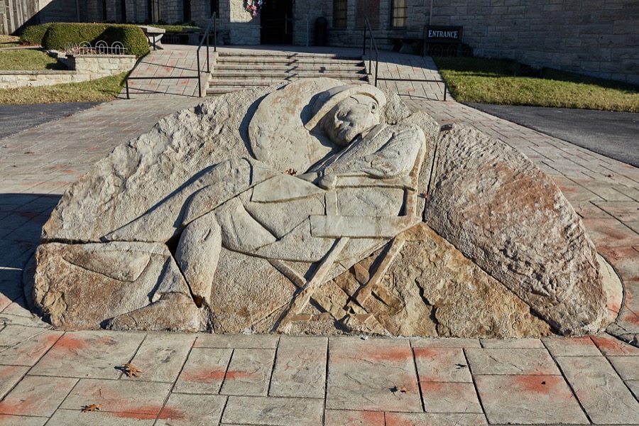 A sculpture, almost flat to the ground, sculpture of the renowned American humorist and movie actor Will Rogers, beloved as "America's Cowboy Philosopher" at the Will Rogers Memorial Museum in Claremore, Oklahoma