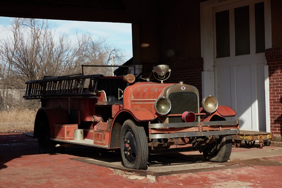 Vintage fire truck at the elegant former Rock Island Railroad depot, now (as of 2020) a local museum in Anadarko, a small city in southwest Oklahoma that (as of 2020) has been struggling with dropping population, increasing unemployment and a downturned local economy