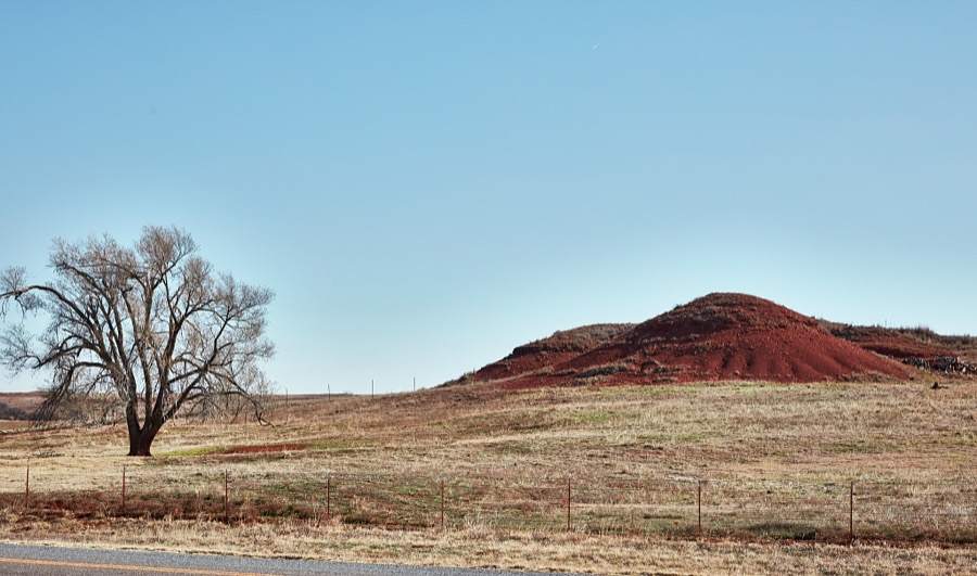 A relatively red-earth hill along old U.S. Route 66 near the town of Foss in the southwestern U.S. state of Oklahoma