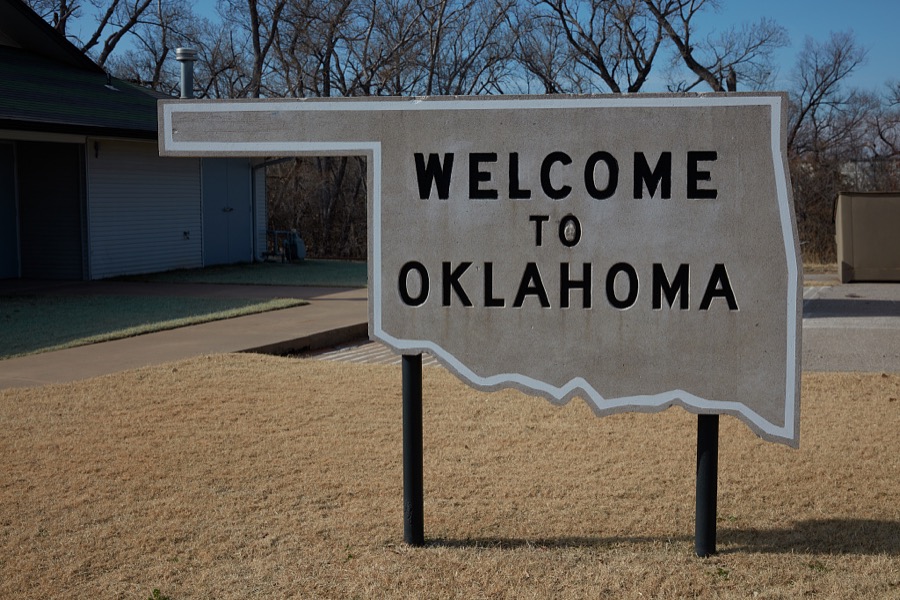 A vintage welcome sign in the shape of the State of Oklahoma outside the Route 66 Museum, operated by the Oklahoma Historical Society on a stretch of the old Chicago-to-Santa Monica U.S. Highway 66 as it runs through Clinton, Oklahoma
