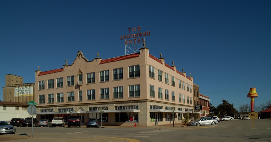 A view of downtown Chickasha (pronounced CHICK-a-shay), Oklahoma, and yes, that is a giant, inflatable object in the shape not only of a lamp but also of a woman's leg, prominently displayed down the street