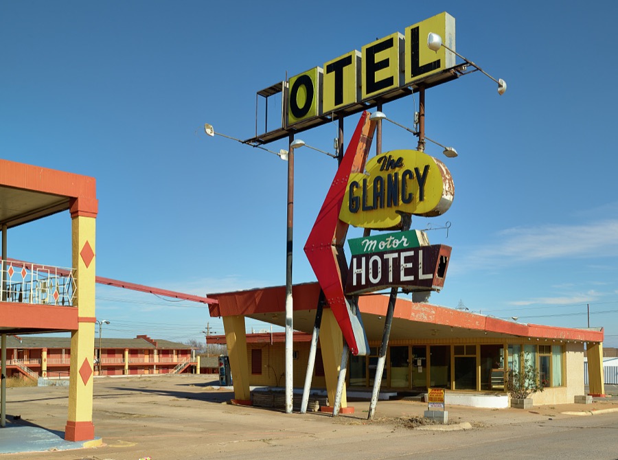 The image of the abandoned Glancy Motor Hotel in the western Oklahoma city of Clinton is partial and so is its sign