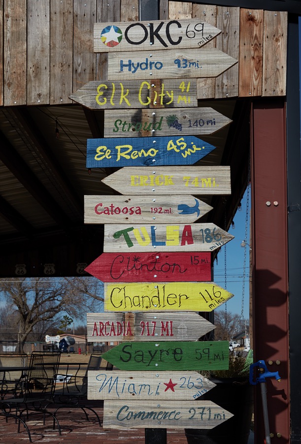 Directional signs in Weatherford, Oklahoma, pointing toward other Oklahoma cities (besides itself) that lie along stretches of old U.S. Highway 66 that (as of 2020) still exist in the state