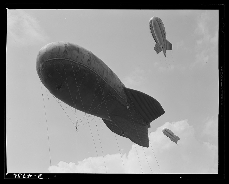Parris Island. Marine Corps barrage balloons. Another stopper for the Axis. Sections of a marine balloon barrage over Paris Island, South Carolina. The swaying balloons with their trailing cables and steel winch lines make dive bombing and ground strafing of important locations too costly in planes and crews