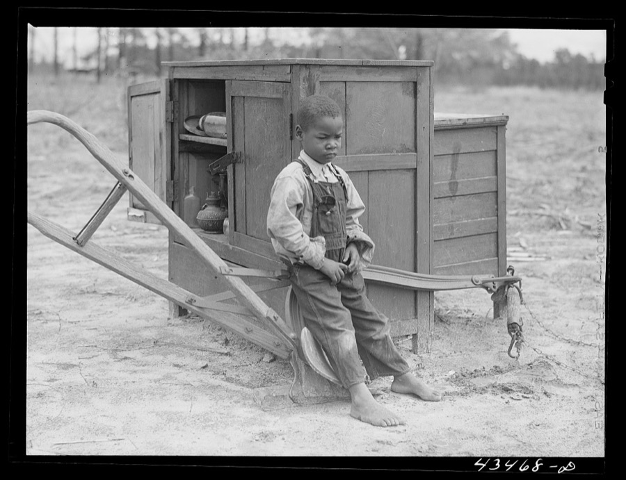 Child of a relocated Santee-Cooper family at his "new" home near Bonneau, South Carolina