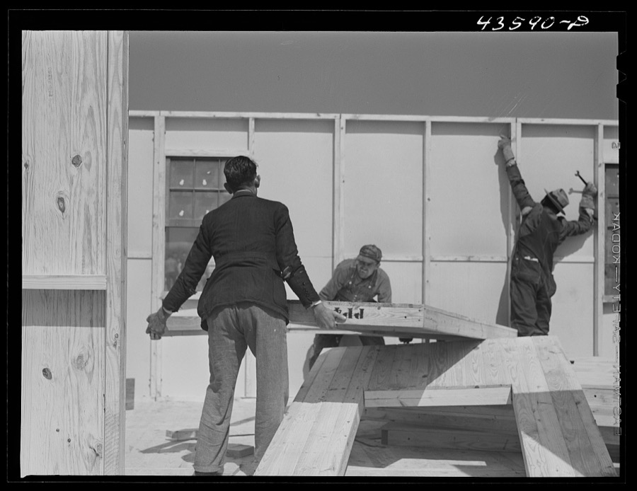 Getting up the walls on a prefabricated house being built by FSA (Farm Security Administration) to house some of the farmers when they move out of the Spartanburg Army camp area. Pacolet, South Carolina region
