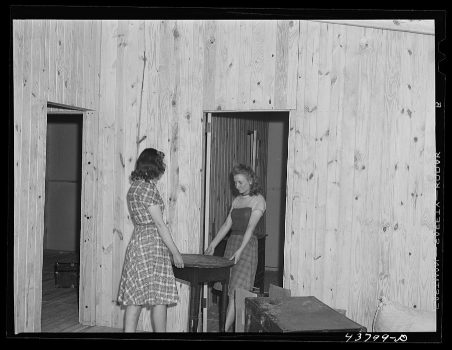 Arranging furniture at the new prefabricated house of the Lee family. Near Pacolet, South Carolina