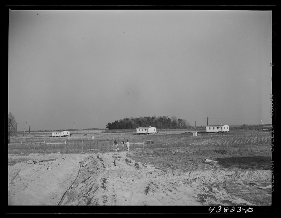 While water pipes are being laid families had to get their water at one of the wells nearby. When water system is completed there will be a pump at every house. Pacolet, South Carolina. At the FSA (Farm Security Administration) prefabricated houses