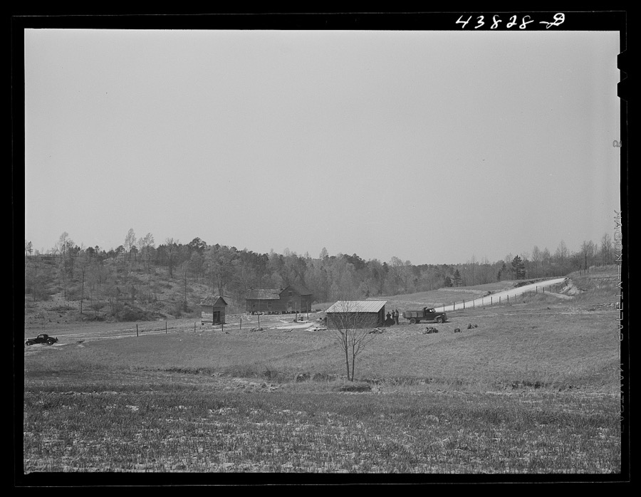 This road is the Camp Croft boundary. The family who lived in the house at the left is moving into the barn on the right