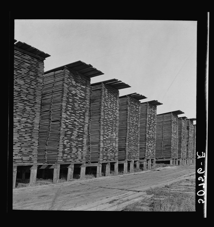 Stacks of lumber at sawmill. Ashepoo, South Carolina