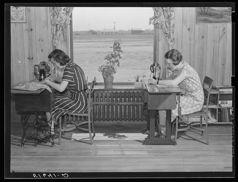 Jane McCutcheon and Ruth Lee Hear at sewing machines in home economics classroom.  School building, Ashwood Plantations, South Carolina