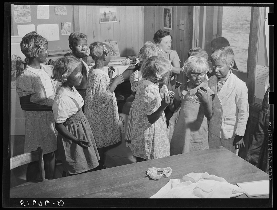 Second and third grade children being made up for their Negro song and dance at May Day-Health Day festivities. Ashwood Plantations, South Carolina