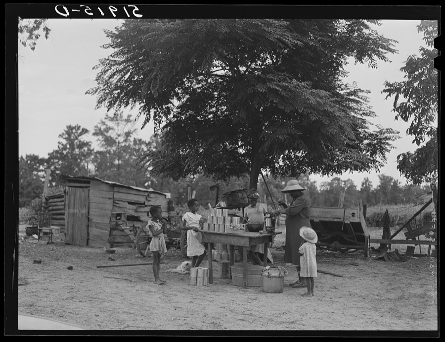 Pauline Clyburn, rehabilitation client, and her children canning tomatoes. Manning, Clarendon County, South Carolina